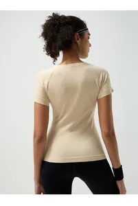 Detailed back view of a slim fit beige yoga t-shirt with breathable raglan sleeves