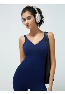 Detailed view of dark blue V-neck yoga bodysuit with seamless straps and stretch fabric