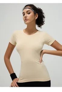 Detail of beige breathable mesh fabric on short-sleeve slim-fit yoga t-shirt for women