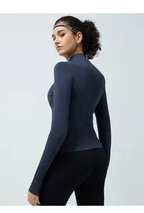 Detail of breathable mesh back on seamless quick-dry yoga jacket with thumb holes