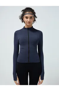 Detail view of seamless fitness jacket featuring thumb hole cuffs and stand-up collar