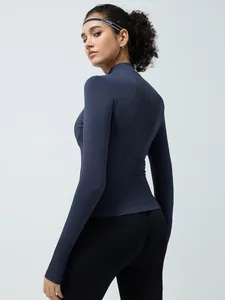 Slim fit navy blue seamless yoga jacket with thumbholes and breathable fabric for fitness