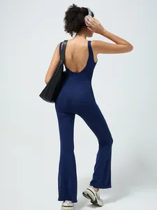 Navy blue backless yoga jumpsuit with built-in pads and wide flare leg silhouette