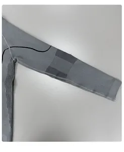 Detailed close-up of grey seamless ski thermal underwear showing high-elastic knit texture