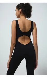 Detail of cross-back hollow design and stretchy fabric on black yoga bodysuit