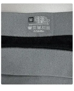 Detail of fabric composition label on grey seamless thermal functional underwear