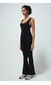 Detail of a black sleeveless yoga jumpsuit with flare legs and breathable ribbed fabric