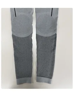 Detail view of seamless compression leggings with functional zoning and knit patterns