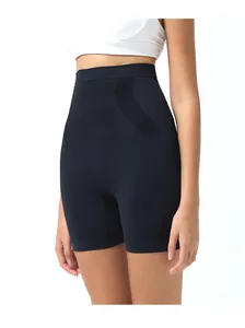Detail of high-waisted seamless yoga shorts showing squat-proof compression fabric