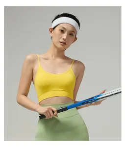 Detail of yellow thin strap sports bra with ribbed hem and high-elastic performance fabric