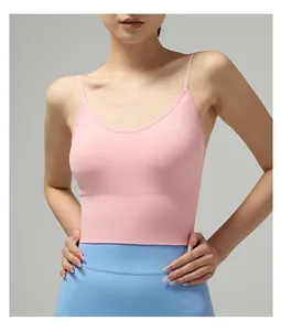 Detail of pink yoga sports bra featuring high-stretch ribbed band and thin shoulder straps
