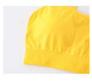 Detailed macro view of the lemon yellow sports bra featuring breathable ribbed hem fabric