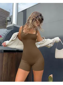 Close-up of brown ribbed yoga bodysuit with square neck and textured seamless fabric