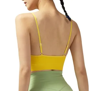 Yellow sports bra with adjustable thin straps and seamless open back design for yoga