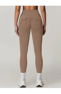 Detail view of high waist yoga pants featuring cargo pockets and ruched butt-lifting design
