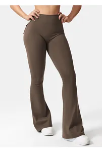 Close-up of high-waist yoga pants with pockets and flared leg in deep brown fabric