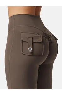 Close-up of brown yoga leggings with side pocket and scrunch butt lifting detail
