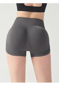 Detail of high waisted seamless yoga shorts with ruched butt lifting design and wide waistband