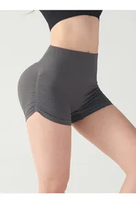 Detailed side view of high-waisted seamless scrunch yoga shorts with ruched lift effect