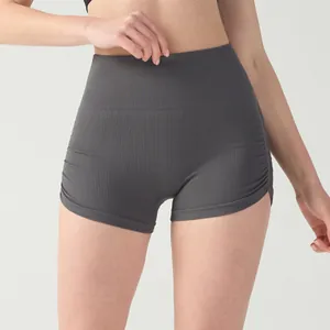 High waisted ruched grey yoga shorts with ribbed knit texture for athletic women