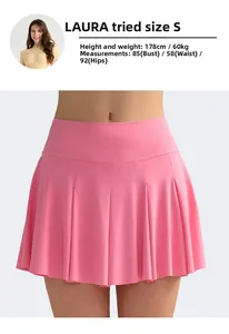 Detailed view of pink high-waisted pleated tennis skirt with elastic fit and S-size fit