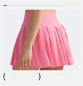 Detail view of pink pleated high-waisted tennis skirt with smooth moisture-wicking fabric