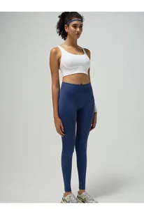 Detail view of high waist yoga pants with breathable fabric and peach butt lift effect