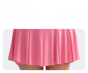 Detail shot of pink pleated tennis skirt showing premium elastic fabric and fine pleats