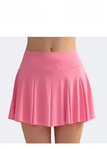 Detail view of pink pleated tennis skirt showing high waist and elastic fabric texture