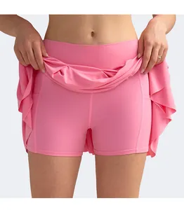 Detail showing inner pocket of the high-waisted bright pink pleated sports tennis skort