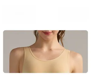 Close-up of smooth neckline stitching and refined craftsmanship on beige yoga bodysuit