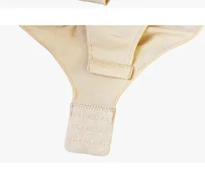 Detail of adjustable triple hook-and-eye closure on beige slimming bodysuit for women