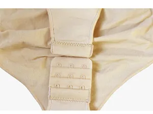 Detail of adjustable triple hook-and-eye closure on beige slimming yoga bodysuit