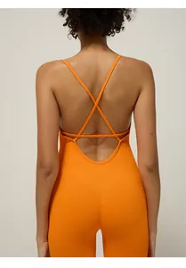 Detail of the bright orange seamless yoga jumpsuit featuring a cross-back hollow out design