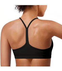 Close-up of black sports bra featuring a thin Y-shaped strap back design on model