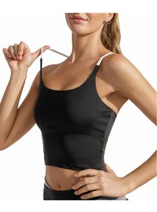 Detail view of the contrast strap design on a black high-impact sports crop top