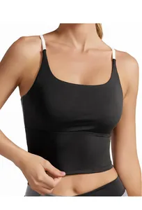 Close-up of black sports bra featuring contrast white thin straps and supportive hem