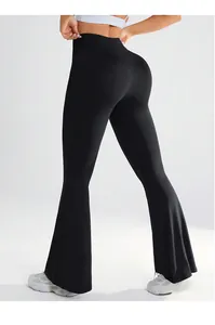 Detail shot of the V-cross high waist and flared leg cut on black yoga pants