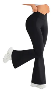 Detail of high-waisted V-cross waistband on black flared yoga leggings for tummy control