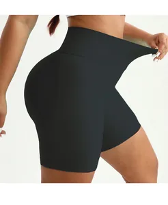 Close-up of high-elasticity wide ribbed waistband on black yoga shorts for tummy control