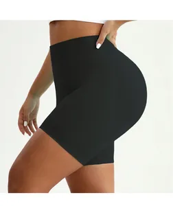 Detail of high-waisted black yoga shorts with tummy control and butt-lifting seam