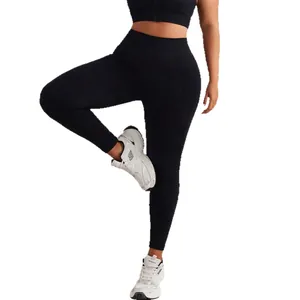 Women's black high-waisted seamless yoga set featuring a zip-up vest and sports leggings