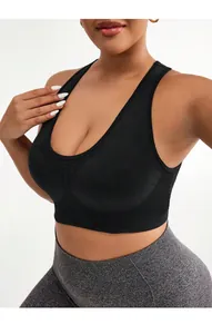 Detail of wide straps and U-neck on a plus size black seamless sports bra