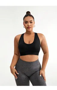 Detail of high-stretch seamless sports bra with U-neck design and elastic yoga leggings