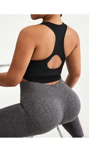 Rear view of black racerback sports bra with cutout design and high-waist yoga leggings