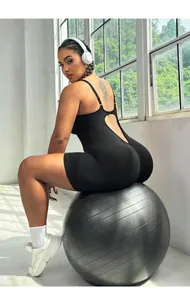 Detail showing the ribbed knit fabric and open back design of the black yoga bodysuit