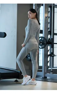Close-up of seamless gray thermal base layer with honeycomb texture and compression zones