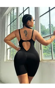 Detail of black one-piece yoga romper with heart-shaped cutout and scrunch butt design