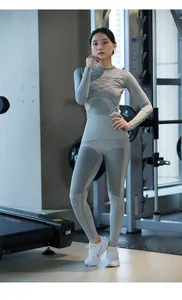 Close-up of grey seamless thermal base layer with breathable honeycomb texture and compression