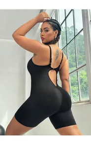 Detail of black cross-back yoga bodysuit with scrunch butt lifting effect for workouts